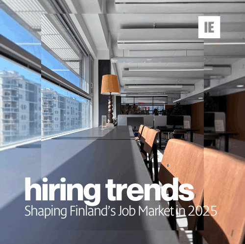 Modern coworking office in Helsinki with natural light and wooden chairs, representing hiring trends shaping Finland’s job market in 2025 by Intelligent Employment.